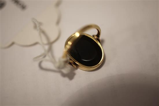 A Roman green chalcedony intaglio in a later gold ring mount, size C.